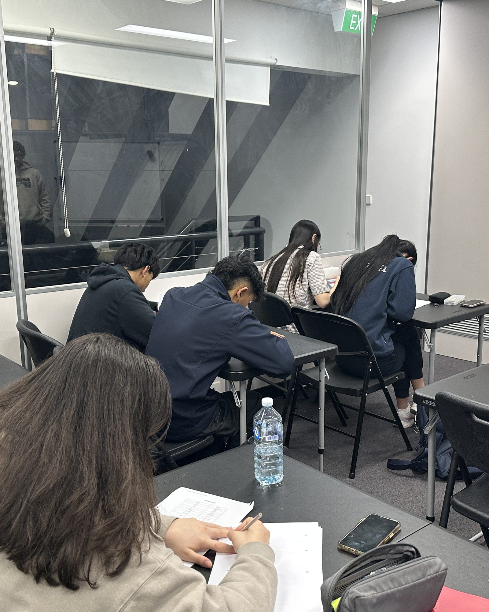 Students working at desks during a Spartan Tuition class
